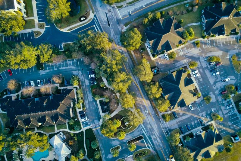 Aerial view of Lake Mary, FL, highlighting residential streets amid lush greenery.