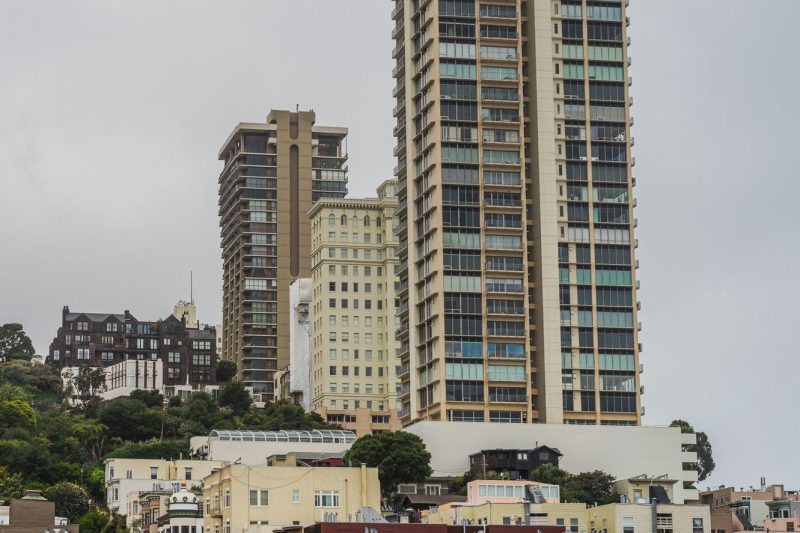 San Francisco skyline with modern residential towers amidst clear blue skies and urban architecture.